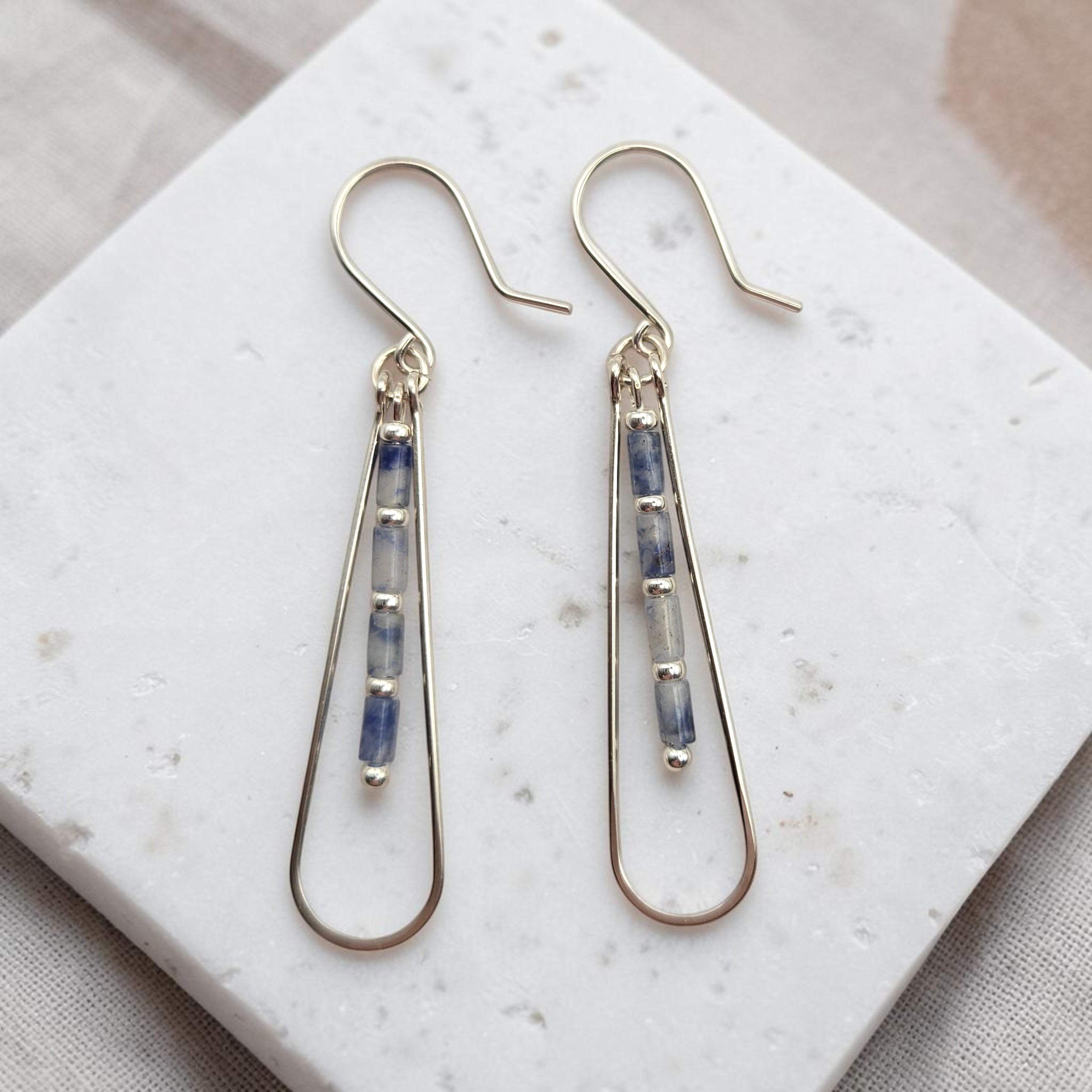Bijou by SAM Stone Creek teardrop earrings featuring blue spot jasper tube beads on sterling silver hoops.