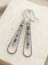 Bijou by SAM Stone Creek teardrop earrings featuring blue spot jasper tube beads in sterling silver hoops.