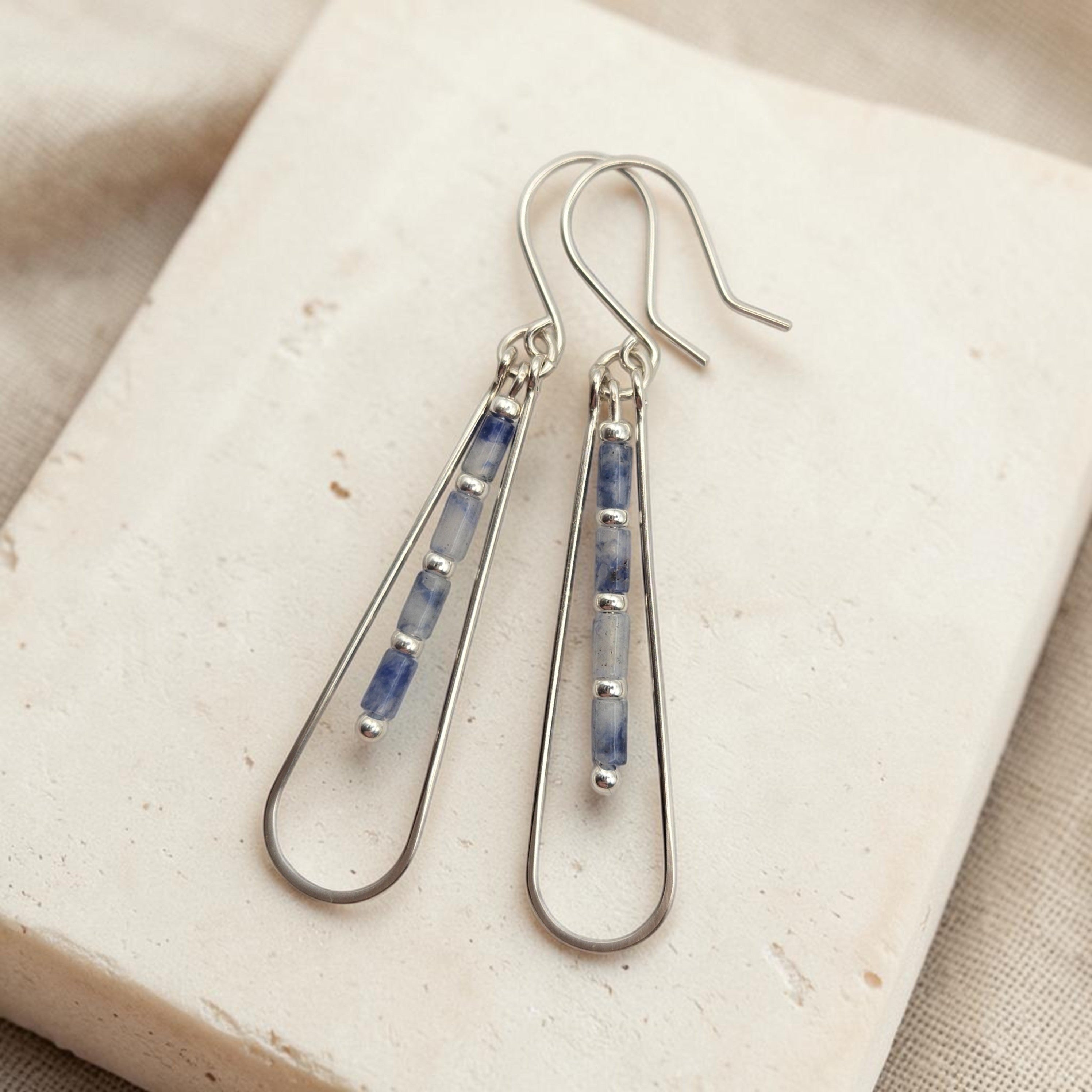 Bijou by SAM Stone Creek teardrop earrings featuring blue spot jasper tube beads in sterling silver hoops.