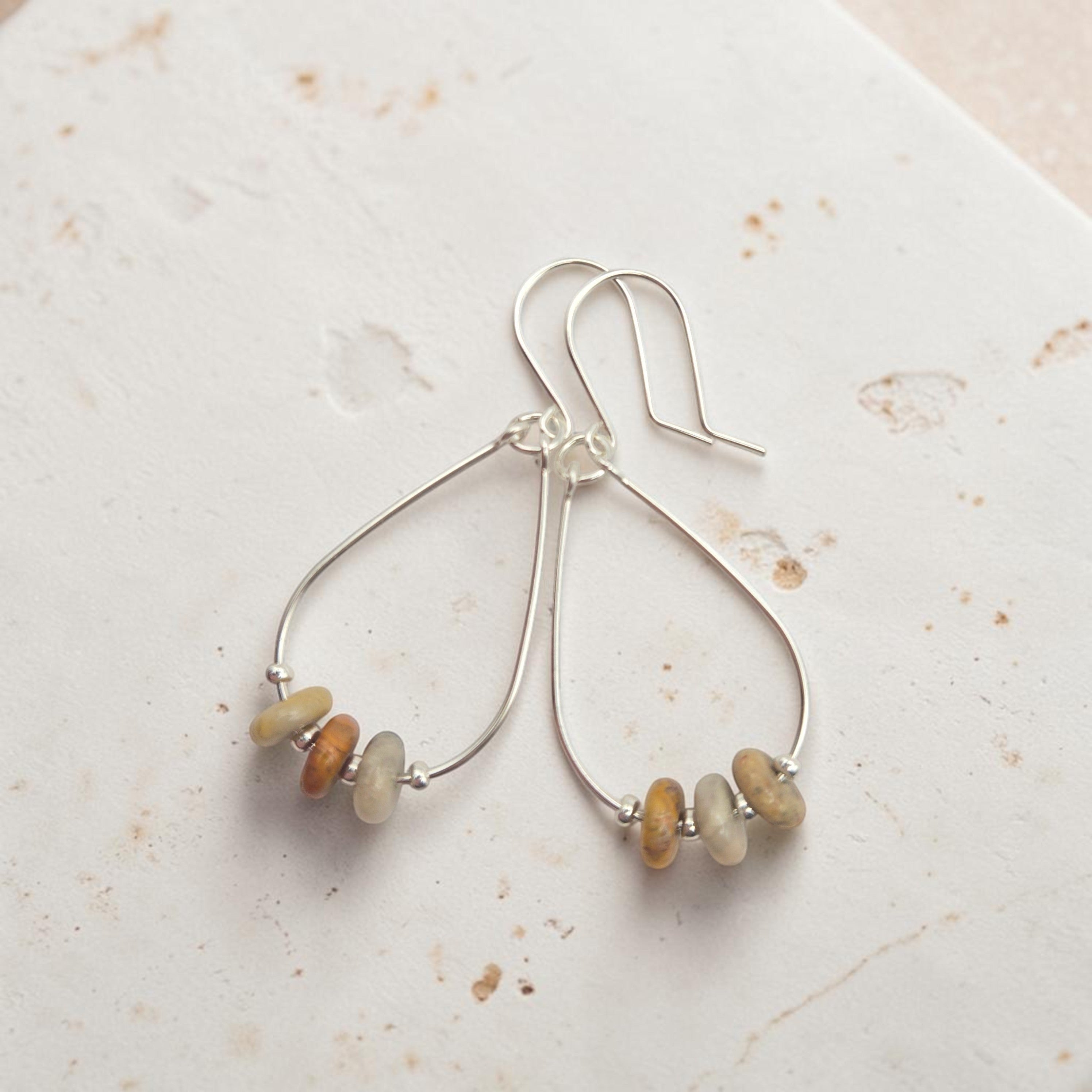 Bijou by SAM Stardust teardrop hoop earrings featuring cream and coral crazy lace agate stones in sterling silver.
