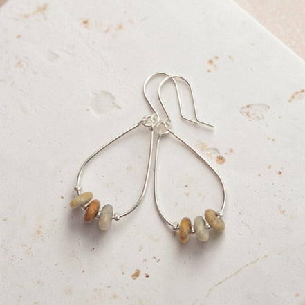 Bijou by SAM Stardust teardrop hoop earrings featuring cream and coral crazy lace agate stones in sterling silver.