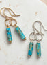 Bijou by SAM Mia earrings featuring turquoise jasper cylinders on handcrafted gold and silver hoops.