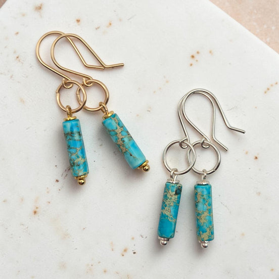 Bijou by SAM Mia earrings featuring turquoise jasper cylinders on handcrafted gold and silver hoops.