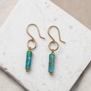 Bijou by SAM Mia earrings featuring turquoise jasper cylinders on 14k gold fill hoops and earwires.