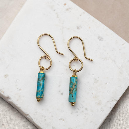 Bijou by SAM Mia earrings featuring turquoise jasper cylinders on 14k gold fill hoops and earwires.