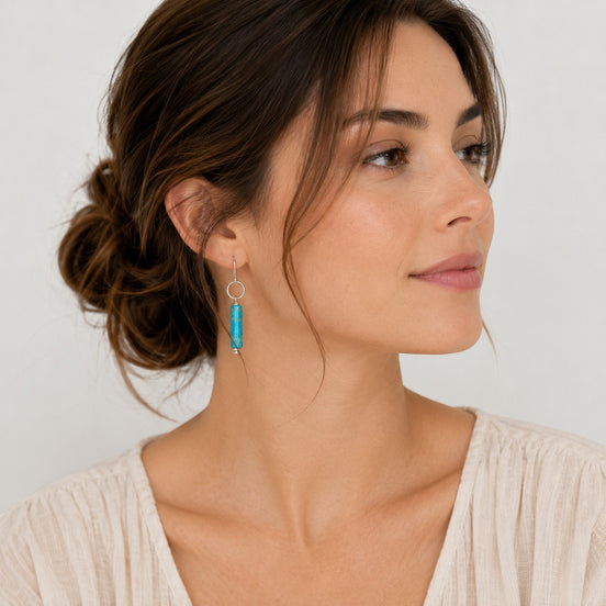 Bijou by SAM Mia earrings featuring turquoise jasper cylinders on handcrafted sterling silver hoops worn by a model.