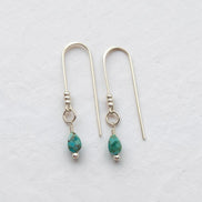 Bijou by SAM handcrafted silver threader earrings featuring genuine teardrop turquoise gemstones on a white background