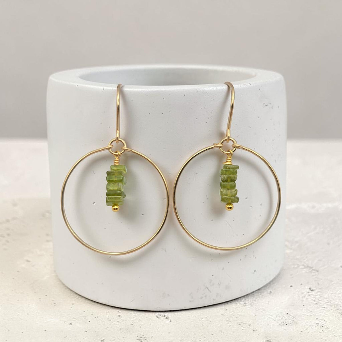 Bijou by SAM handmade gold hoop earrings featuring a delicate stack of square-cut deep green Vesuvianite gemstones.