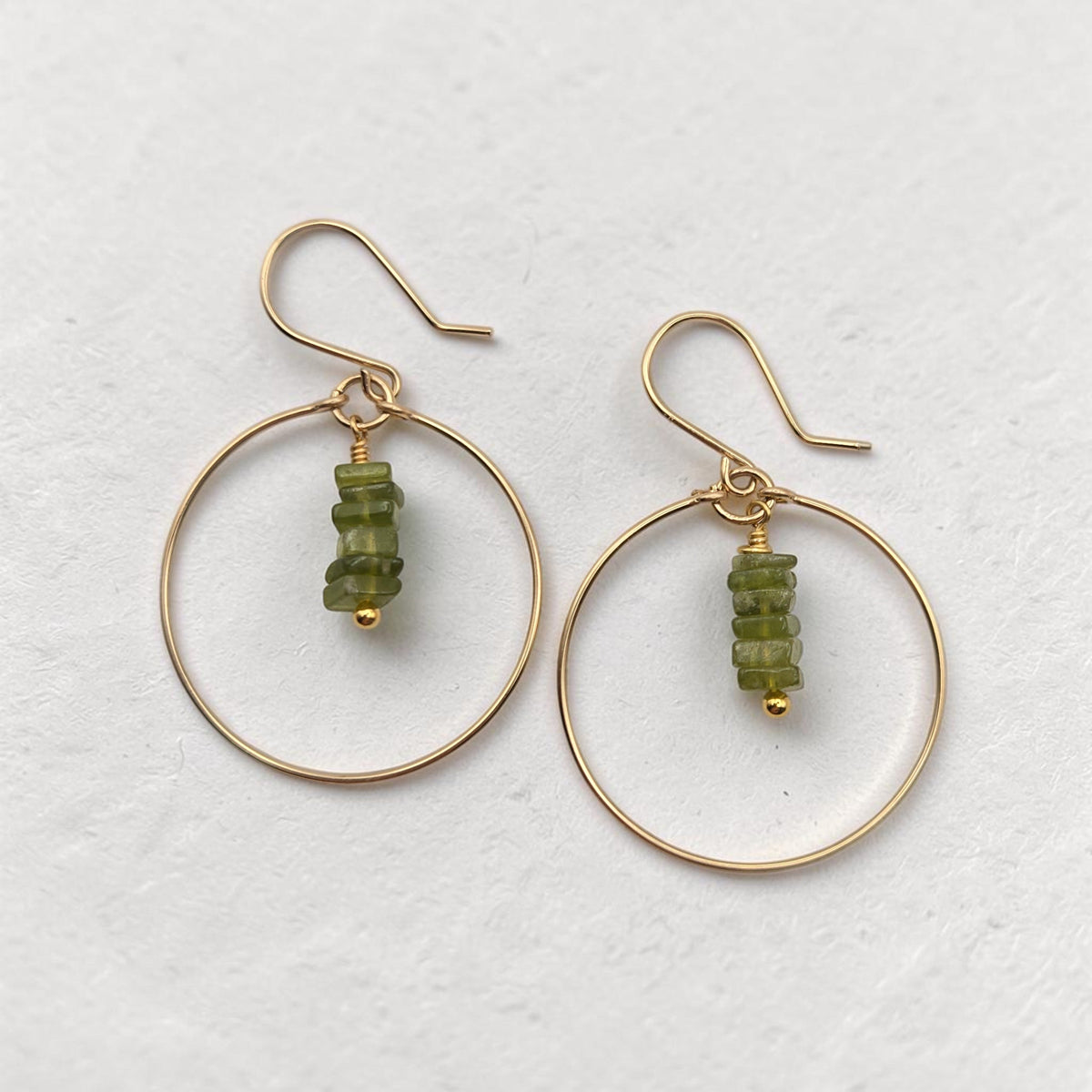 Bijou by SAM handmade gold hoop earrings featuring a delicate stack of square-cut deep green Vesuvianite gemstones.