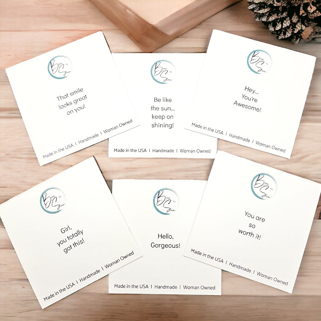 Set of six motivational cards on a wooden surface