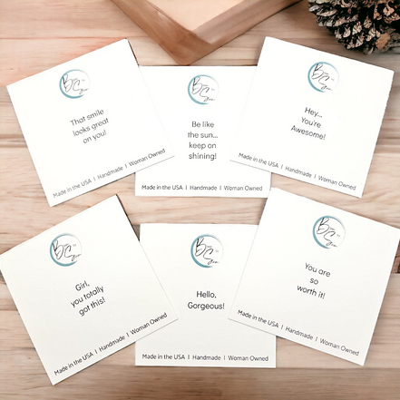Set of six motivational cards on a wooden surface
