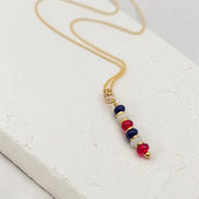 Necklace with colorful beads on a white surface