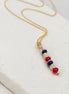 Necklace with colorful beads on a white surface