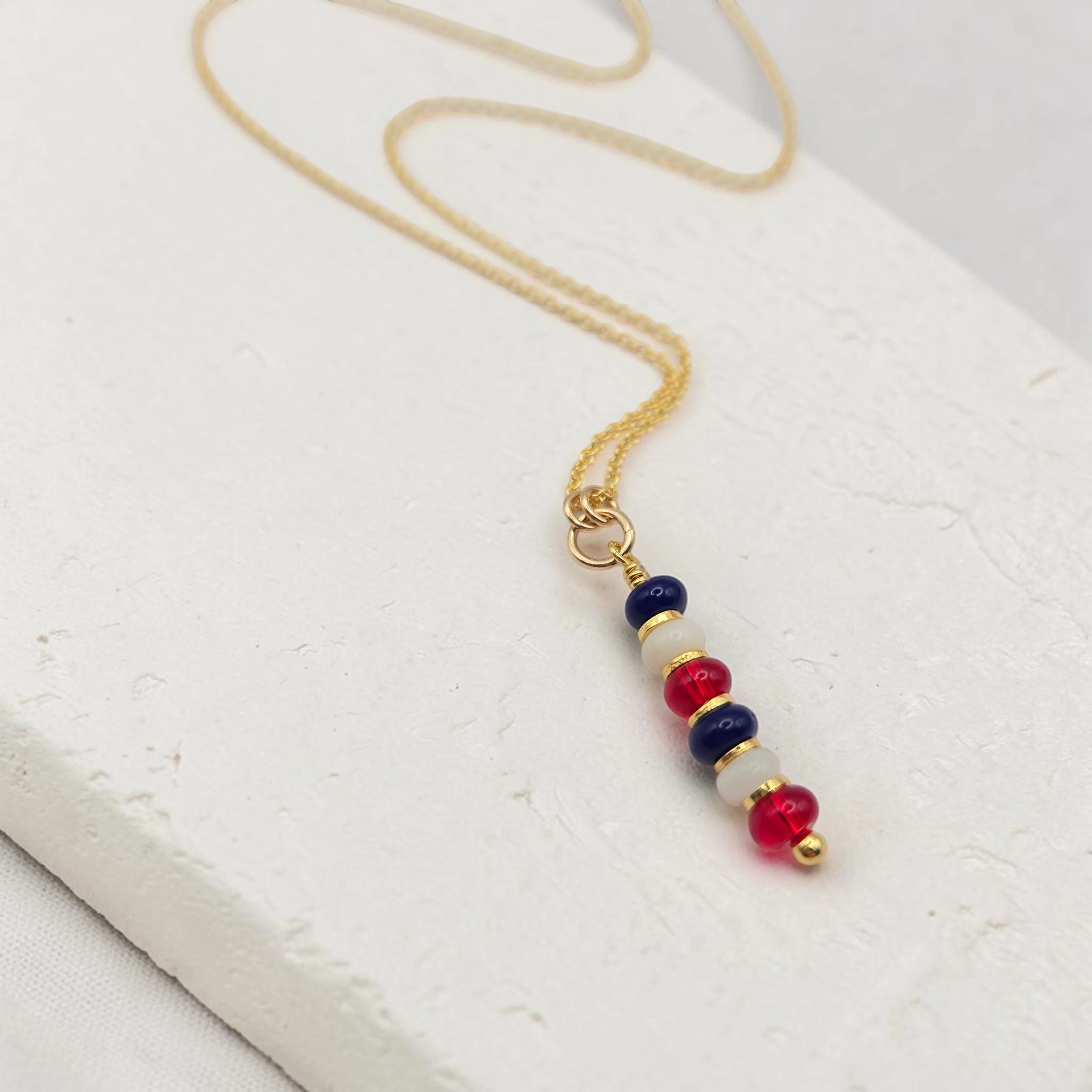 Necklace with colorful beads on a white surface