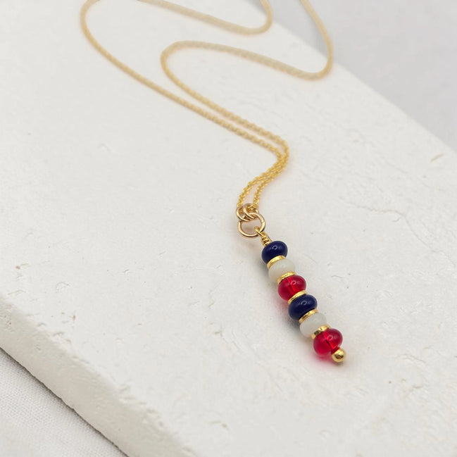 Necklace with colorful beads on a white surface
