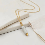 Necklace with a marble pendant on a light background