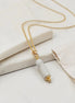 Necklace with a marble pendant on a light background