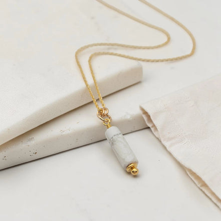 Necklace with a marble pendant on a light background