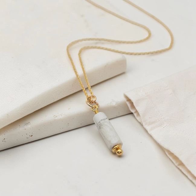 Necklace with a marble pendant on a light background